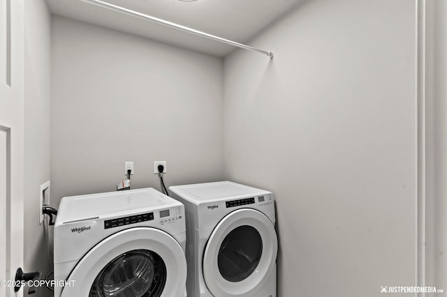 laundry room with separate washer and dryer