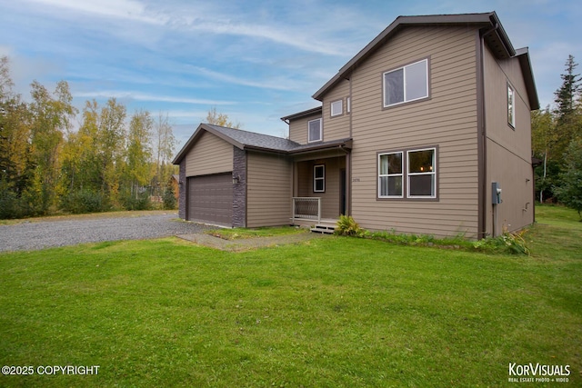 front of property with a front lawn and a garage