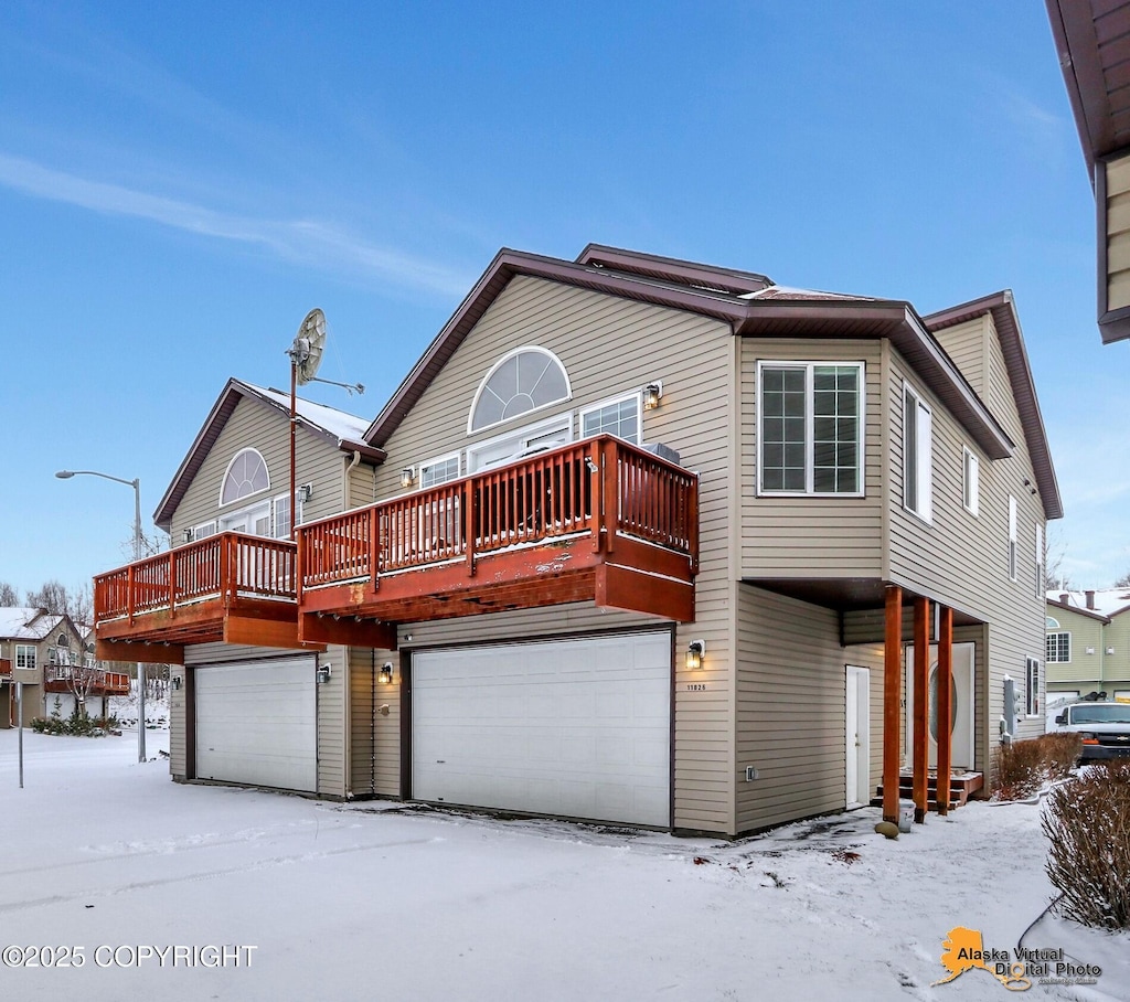 view of front of property featuring a wooden deck and a garage