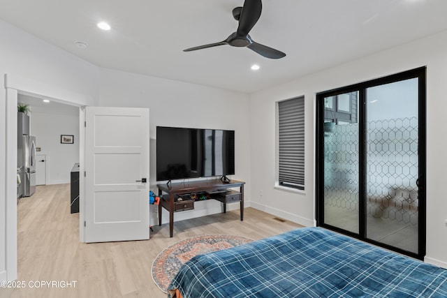 bedroom featuring stainless steel fridge, access to exterior, ceiling fan, and light hardwood / wood-style floors