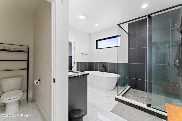 bathroom featuring shower with separate bathtub, toilet, and tile walls