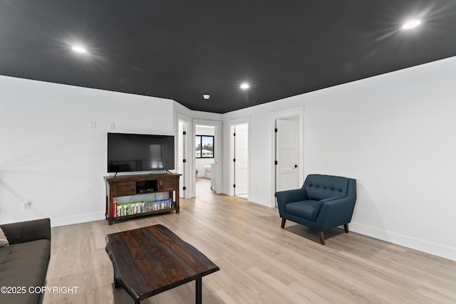 living room with light hardwood / wood-style flooring