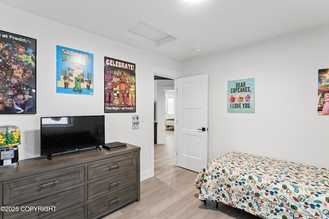 bedroom with light hardwood / wood-style floors