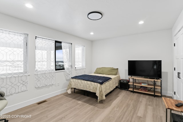 bedroom featuring light hardwood / wood-style floors