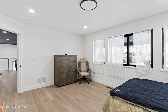 bedroom with light wood-type flooring