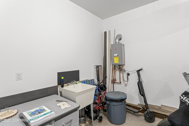 utility room featuring sink and tankless water heater