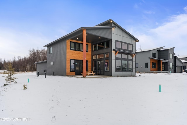 view of snow covered house