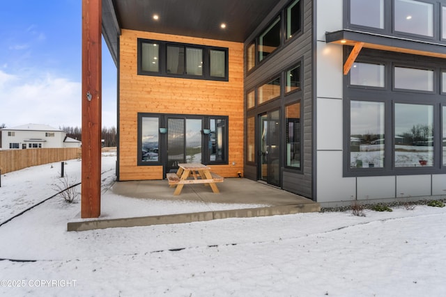 view of snow covered house