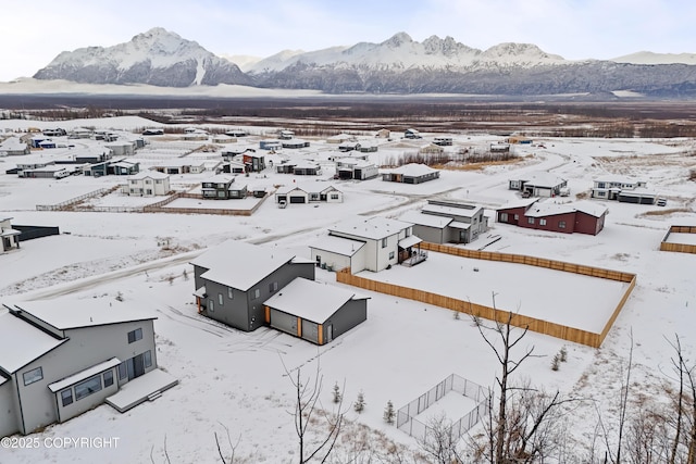 snowy aerial view with a mountain view