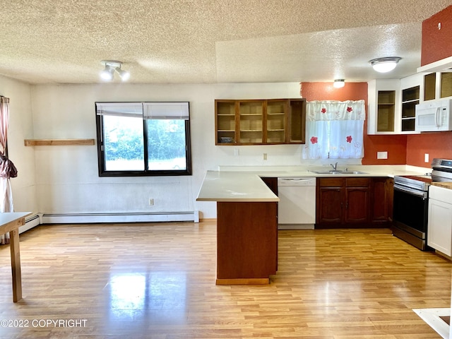 kitchen with kitchen peninsula, white appliances, sink, a baseboard radiator, and light hardwood / wood-style flooring