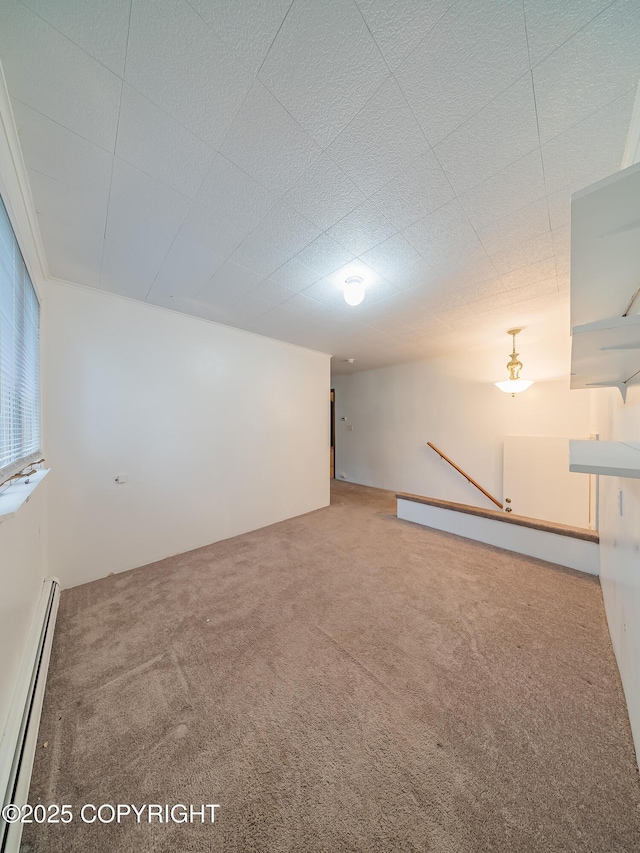 interior space with carpet flooring and a baseboard radiator