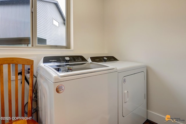 laundry room with separate washer and dryer