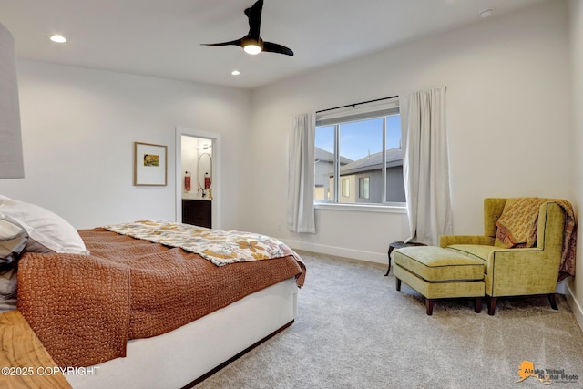 bedroom featuring ceiling fan, connected bathroom, and carpet flooring