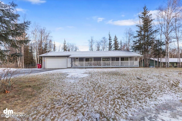 view of front of house with a garage and a porch