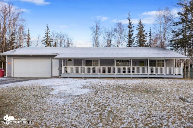 view of front facade with a garage and covered porch