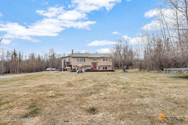 5450 E Alder Dr, Wasilla, AK 99654 - exterior space with a front yard and a chimney