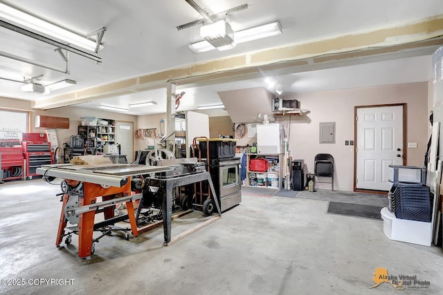 5450 E Alder Dr, Wasilla, AK 99654 - garage featuring a garage door opener and electric panel
