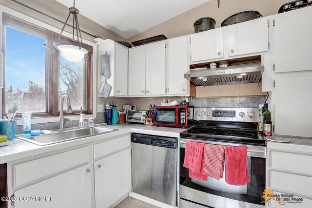 5450 E Alder Dr, Wasilla, AK 99654 - kitchen featuring a sink, light countertops, extractor fan, stainless steel appliances, and white cabinetry