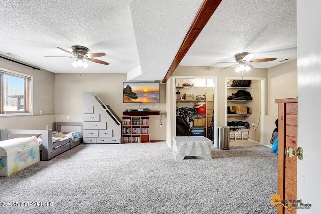 5450 E Alder Dr, Wasilla, AK 99654 - carpeted bedroom with ceiling fan, a textured ceiling, and visible vents