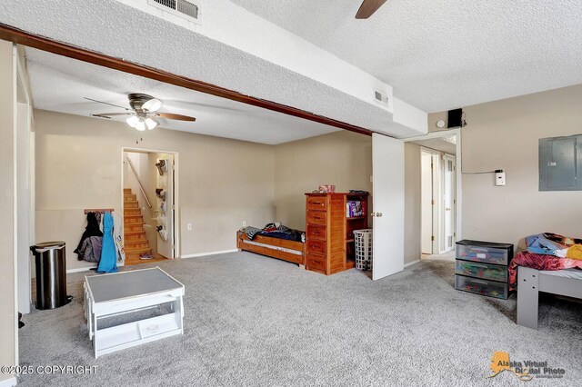 5450 E Alder Dr, Wasilla, AK 99654 - interior space with visible vents, ceiling fan, a textured ceiling, electric panel, and carpet