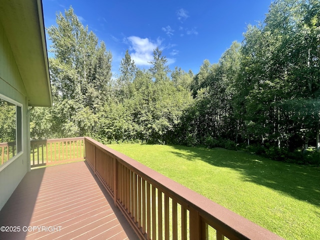 wooden deck with a yard