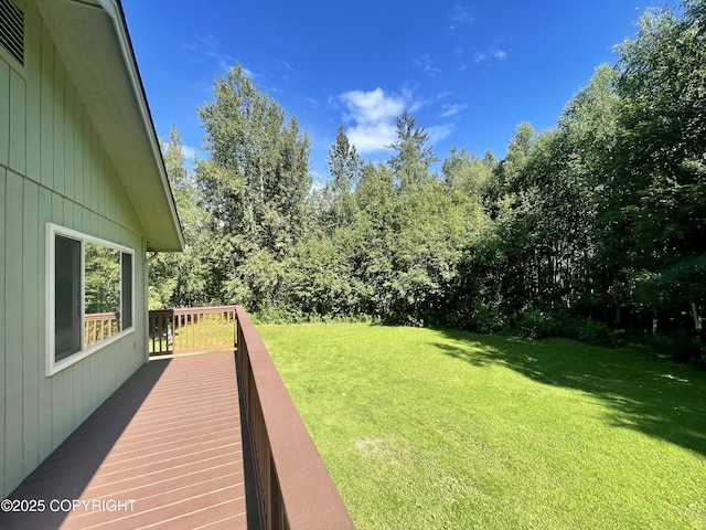 view of yard featuring a wooden deck