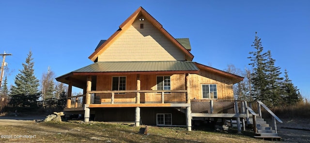 back of house with a wooden deck