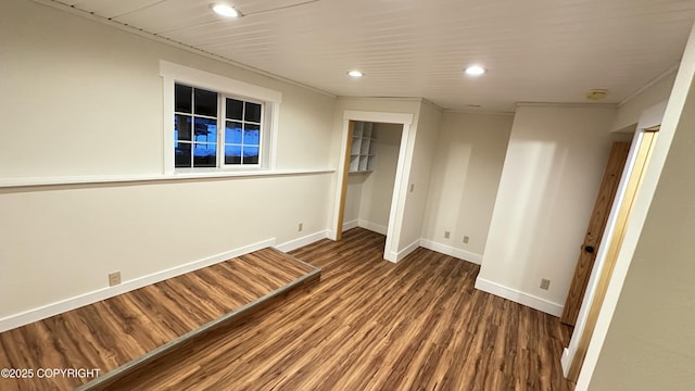 unfurnished bedroom featuring a closet and dark hardwood / wood-style flooring