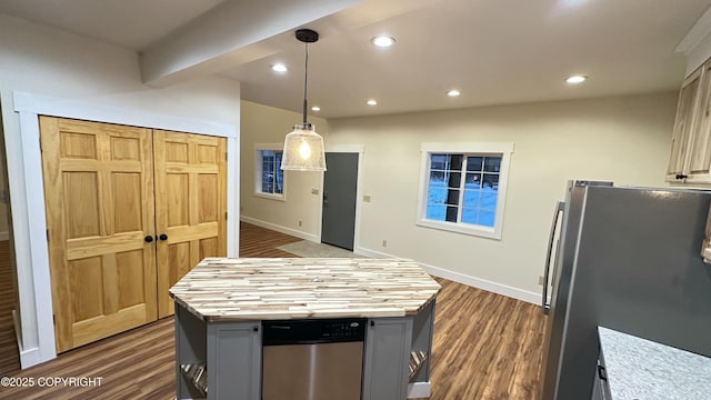 kitchen with butcher block counters, gray cabinets, stainless steel appliances, hanging light fixtures, and a center island