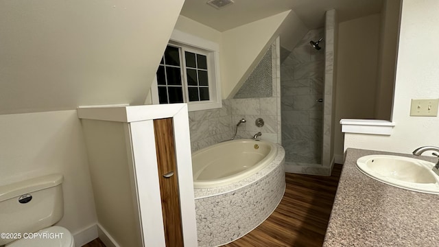 full bathroom featuring plus walk in shower, toilet, hardwood / wood-style floors, and vanity