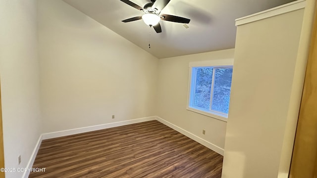 empty room featuring lofted ceiling, ceiling fan, and dark hardwood / wood-style floors