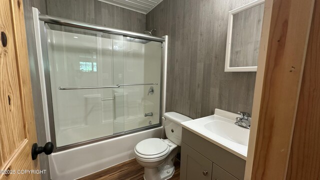 9742 W Trimotor St, Wasilla, AK 99623 - bathroom with shower / bath combination with glass door, vanity, toilet, and wood finished floors