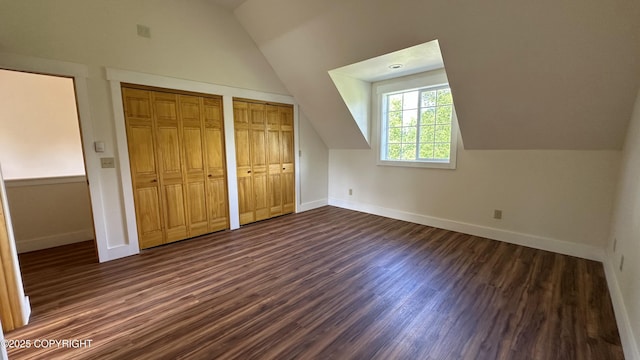 9742 W Trimotor St, Wasilla, AK 99623 - additional living space with lofted ceiling, baseboards, and dark wood-style floors