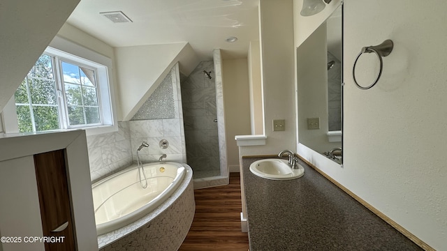 9742 W Trimotor St, Wasilla, AK 99623 - full bathroom featuring a stall shower, vanity, a garden tub, and wood finished floors