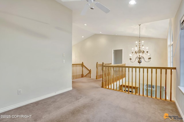 hallway with an inviting chandelier, carpet flooring, and lofted ceiling