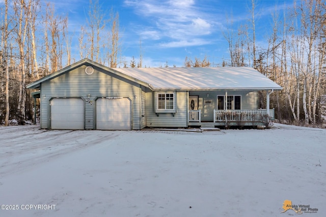 ranch-style house with a porch and a garage