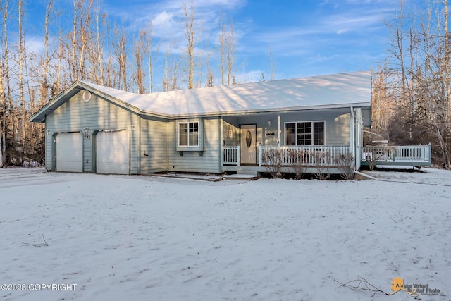 view of front of house featuring a garage and covered porch