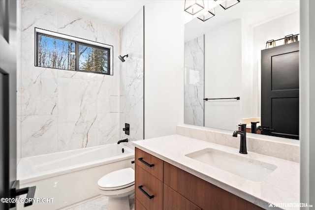 full bathroom with tiled shower / bath combo, vanity, and toilet