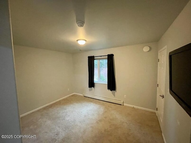 unfurnished room with a baseboard radiator