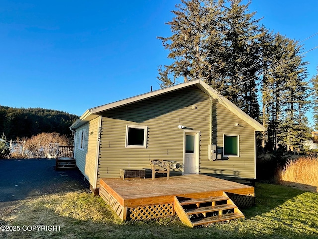 back of property featuring a deck