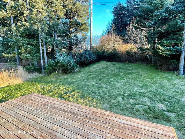 view of yard with a wooden deck