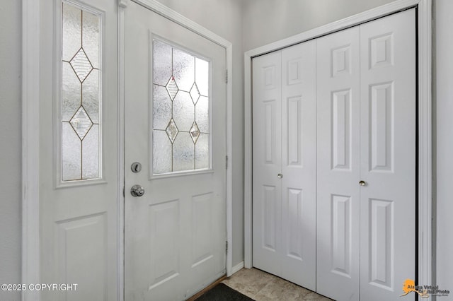 foyer entrance featuring light tile patterned floors