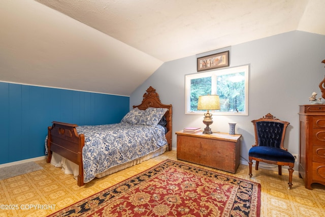 bedroom featuring lofted ceiling