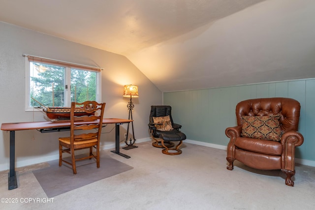 home office featuring carpet floors and vaulted ceiling