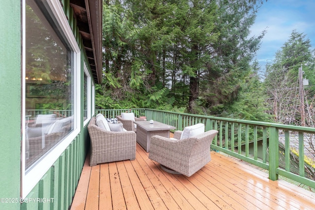 wooden deck featuring an outdoor living space