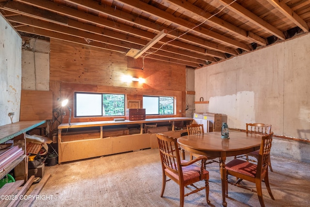 dining space with beam ceiling and wood ceiling