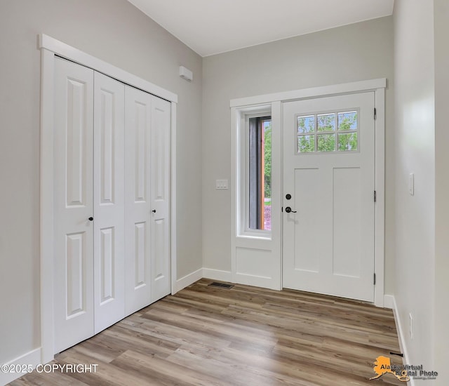 foyer entrance featuring light wood-type flooring