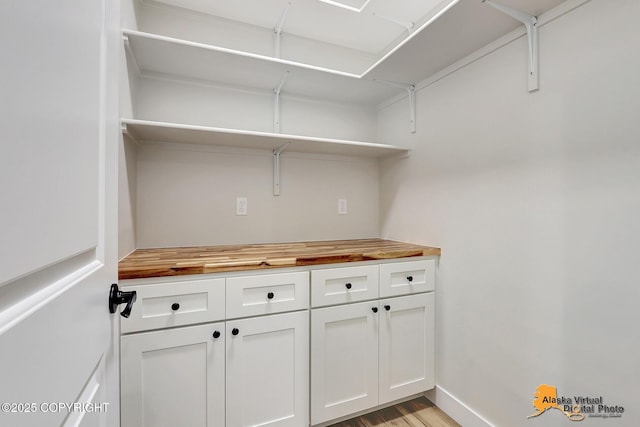 laundry area featuring light hardwood / wood-style flooring