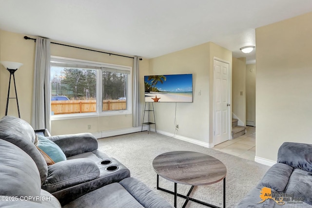 living area with stairway, baseboards, and light colored carpet