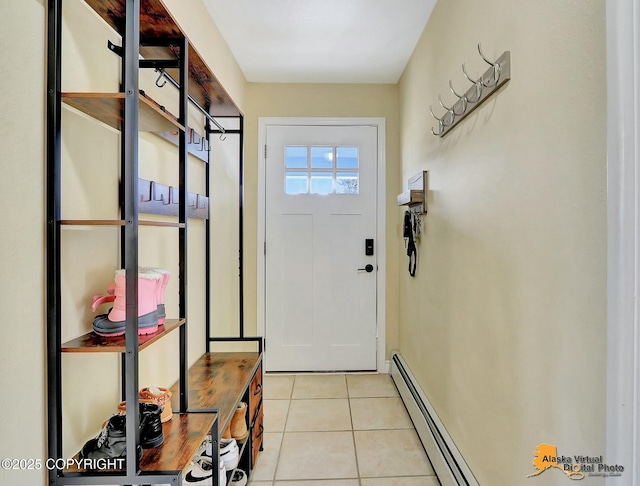 entryway featuring light tile patterned floors and a baseboard heating unit